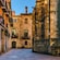 A picture of a cobblestone street lined with Gothic stone buildings in Barcelona